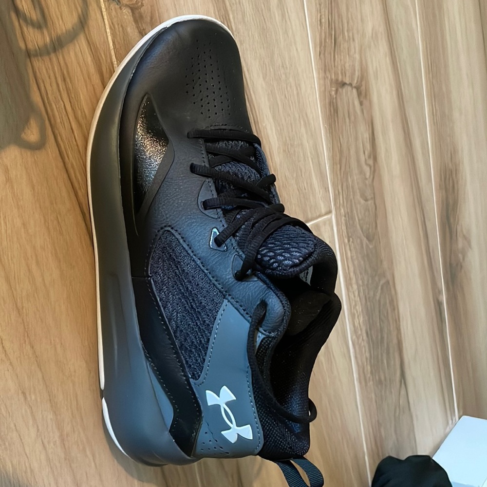 Never worn Under Armour high top sneakers.